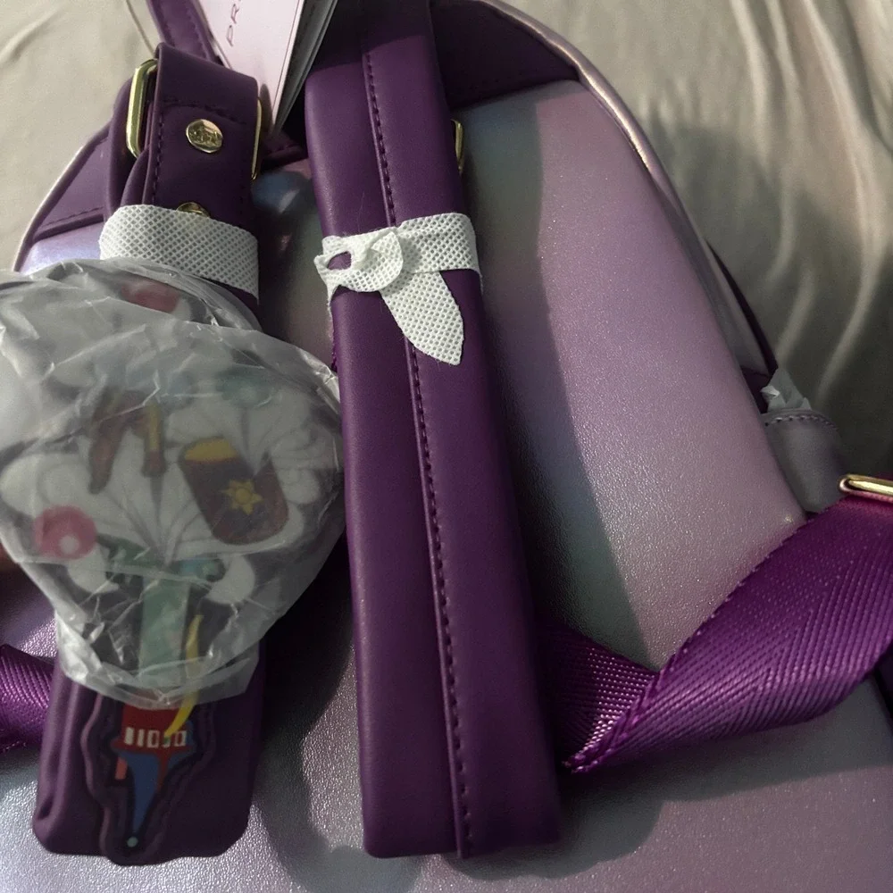 Disney Loungefly Tangled Rapunzel Birthday Cake Mini Backpack Iridescent Purple